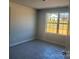 Well-lit room with a large window providing ample natural light and a view of the outdoors at 200 Fostoria Pl # 78A, Albemarle, NC 28001