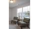 Bedroom with two armchairs and large window at 200 Fostoria Pl # 78A, Albemarle, NC 28001