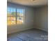 Bedroom with a large window offering abundant natural light and a view of the surrounding area at 200 Fostoria Pl # 78A, Albemarle, NC 28001