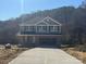 Two-story home featuring a spacious driveway and an attached garage at 200 Fostoria Pl # 78A, Albemarle, NC 28001