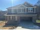 Two-story home featuring a spacious driveway and an attached garage at 200 Fostoria Pl # 78A, Albemarle, NC 28001