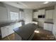 Kitchen featuring stainless steel appliances, island, and white cabinets at 200 Fostoria Pl # 78A, Albemarle, NC 28001