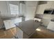 Kitchen with stainless steel appliances, island, and white cabinets at 200 Fostoria Pl # 78A, Albemarle, NC 28001