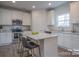 Island kitchen with granite countertops and stainless steel appliances at 200 Fostoria Pl # 78A, Albemarle, NC 28001
