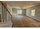 Bright living room with large windows and a ceiling fan at 200 Fostoria Pl # 78A, Albemarle, NC 28001