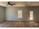 Living room featuring a ceiling fan and a door to the outside deck at 200 Fostoria Pl # 78A, Albemarle, NC 28001