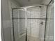 Sleek shower with gray subway tile, a glass enclosure, and stylish fixtures at 200 Fostoria Pl # 78A, Albemarle, NC 28001