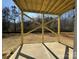 Covered patio area with exposed wooden beams and large concrete pad, ready for outdoor entertaining at 202 Fostoria Pl # 78B, Albemarle, NC 28001