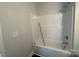 Standard bathroom tub with white surround and brushed metal fixtures at 202 Fostoria Pl # 78B, Albemarle, NC 28001