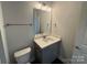 Well-lit bathroom with modern vanity, sink, and fixtures at 202 Fostoria Pl # 78B, Albemarle, NC 28001