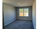 Bedroom featuring a window and neutral carpet at 202 Fostoria Pl # 78B, Albemarle, NC 28001