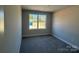 Empty room with large window providing natural light and views at 202 Fostoria Pl # 78B, Albemarle, NC 28001