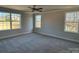 Spacious bedroom with natural light from three windows and neutral carpet at 202 Fostoria Pl # 78B, Albemarle, NC 28001