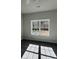 Bedroom with large window and plush carpeting at 202 Fostoria Pl # 78B, Albemarle, NC 28001