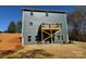 Rear exterior of a home with a deck and partially landscaped yard at 202 Fostoria Pl # 78B, Albemarle, NC 28001