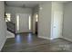 Welcoming foyer with wood-look flooring, stairs, and a front door with sidelights at 202 Fostoria Pl # 78B, Albemarle, NC 28001