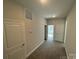 Upstairs hallway with neutral walls and carpet at 202 Fostoria Pl # 78B, Albemarle, NC 28001