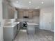 Modern kitchen featuring gray cabinets, subway tile backsplash and stainless steel appliances at 202 Fostoria Pl # 78B, Albemarle, NC 28001