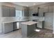 Modern kitchen featuring gray cabinets, subway tile backsplash and stainless steel appliances at 202 Fostoria Pl # 78B, Albemarle, NC 28001