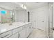 Well-lit bathroom with a double sink vanity, marble floors, and a glass-enclosed shower at 2234 Millennium Dr # 84, Lancaster, SC 29720