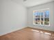 Bright bedroom with hardwood floors and a large window offering a pleasant view of the outdoors at 2234 Millennium Dr # 84, Lancaster, SC 29720