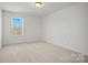 Neutral carpeted bedroom with large window at 2234 Millennium Dr # 84, Lancaster, SC 29720