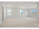 Large bonus room with neutral carpet and many windows at 2234 Millennium Dr # 84, Lancaster, SC 29720