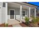 Charming front porch with classic white columns, a stylish front door, and tasteful landscaping at 2234 Millennium Dr # 84, Lancaster, SC 29720