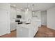 Modern kitchen with stainless appliances, a large island with quartz countertops, and bright white cabinetry at 2234 Millennium Dr # 84, Lancaster, SC 29720