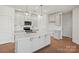 Modern kitchen with stainless appliances, bright white cabinetry and large island, with hardwood floors at 2234 Millennium Dr # 84, Lancaster, SC 29720