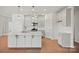 Modern kitchen with an island, stainless appliances, and bright white cabinetry at 2234 Millennium Dr # 84, Lancaster, SC 29720