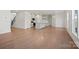 Open concept home with hardwood floors, modern kitchen with a large island, and great natural light at 2234 Millennium Dr # 84, Lancaster, SC 29720
