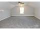 Large bonus room with carpet and window at 2270 Charlotte Hwy, York, SC 29745