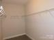 Spacious walk-in closet with wire shelving and hanging rods at 2270 Charlotte Hwy, York, SC 29745