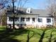 Two-story white house with a gray roof, and a front porch at 2270 Charlotte Hwy, York, SC 29745
