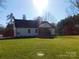 White house back with a screened porch and grassy yard at 2270 Charlotte Hwy, York, SC 29745
