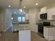 Modern kitchen island with granite countertops and stainless steel appliances at 2270 Charlotte Hwy, York, SC 29745