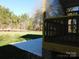 Screened porch with concrete patio and wooded view at 2270 Charlotte Hwy, York, SC 29745