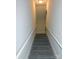 Gray carpeted staircase with white railings at 2270 Charlotte Hwy, York, SC 29745