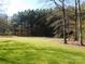 Spacious backyard with mature trees and grassy area at 2270 Charlotte Hwy, York, SC 29745