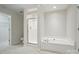 Bathroom featuring a separate shower and soaking tub and tiled flooring at 310 Rose Garden Ct, Rock Hill, SC 29732