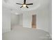 Spacious bedroom with a tray ceiling, neutral walls, and plush carpeting at 310 Rose Garden Ct, Rock Hill, SC 29732