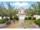 Charming two-story home with a well-maintained yard and beautiful flowering trees at 310 Rose Garden Ct, Rock Hill, SC 29732