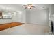 Bright living room featuring a ceiling fan, fireplace, neutral walls, and carpet flooring at 310 Rose Garden Ct, Rock Hill, SC 29732