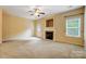 Living room with fireplace, carpet, and door to patio at 310 Rose Garden Ct, Rock Hill, SC 29732