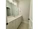 Elegant bathroom featuring a white vanity with marble countertops, a large mirror, and modern chrome hardware at 3850 Willow Grove Ln # 24, Concord, NC 28025