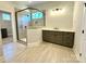 Bathroom featuring a glass shower, vanity with storage, and tiled floors at 3850 Willow Grove Ln # 24, Concord, NC 28025