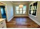 Bright dining area with hardwood floors, large windows, and modern light fixture at 3850 Willow Grove Ln # 24, Concord, NC 28025