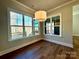 Cozy dining area with hardwood flooring and large windows at 3850 Willow Grove Ln # 24, Concord, NC 28025