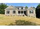 Charming brick home with a welcoming front porch and manicured lawn at 3850 Willow Grove Ln # 24, Concord, NC 28025